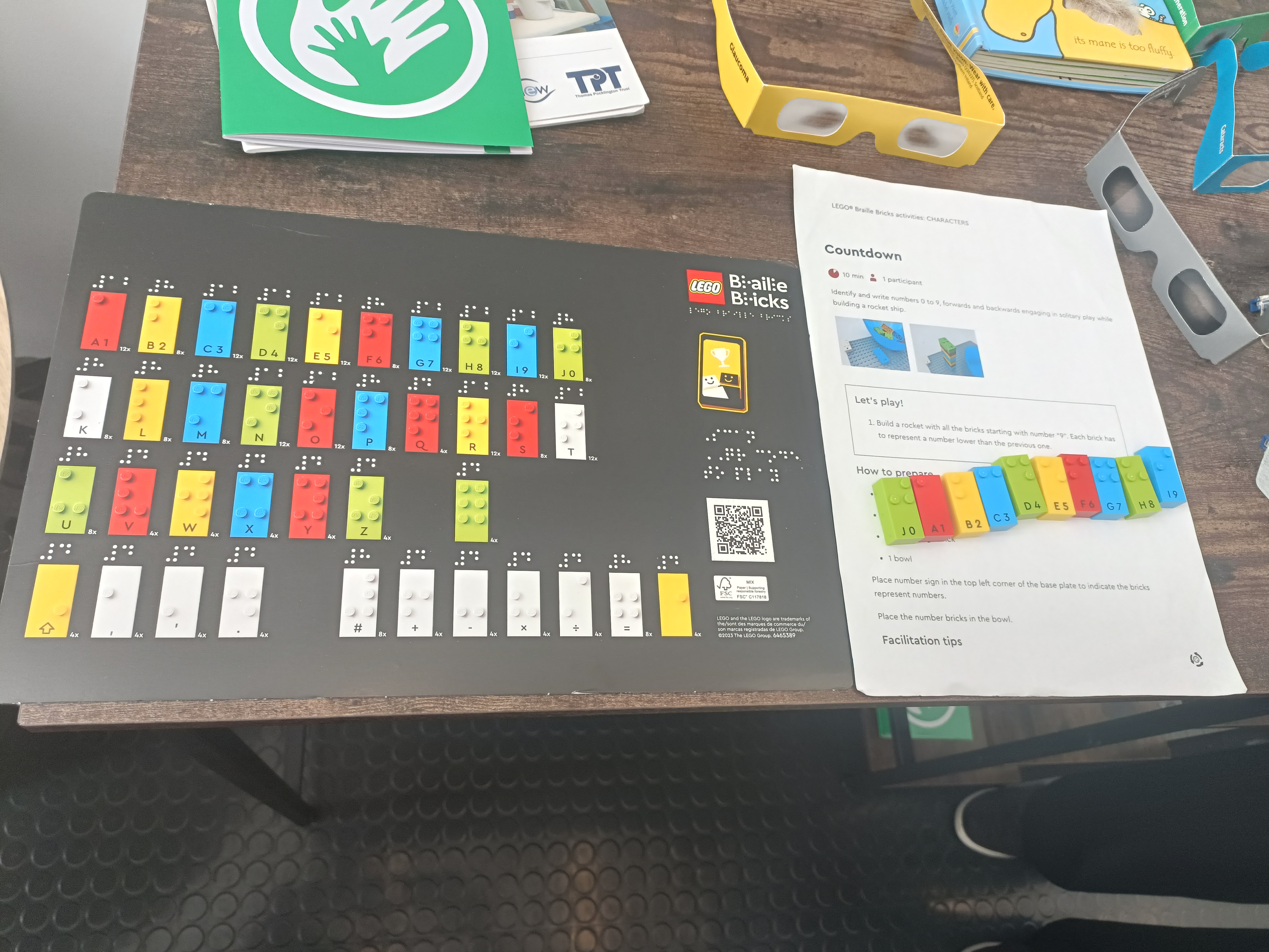 An image of Lego bricks that are specifically printed with braille to make them accessible.